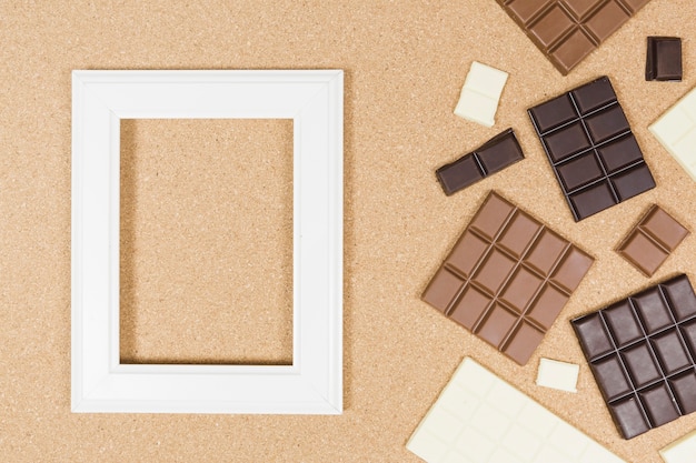 Free Photo top view chocolate arrangement with frame