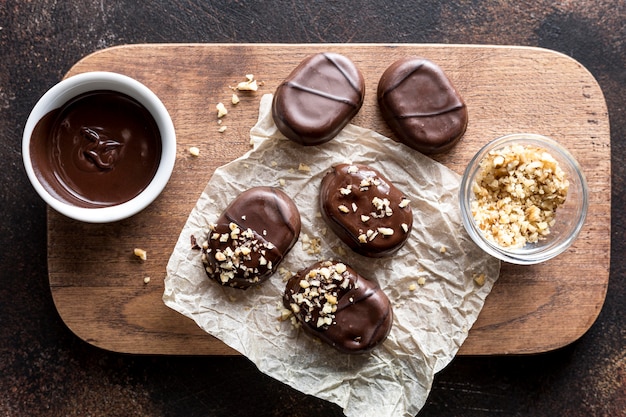 Free photo top view of chocolate assortments of candy with grounded nuts