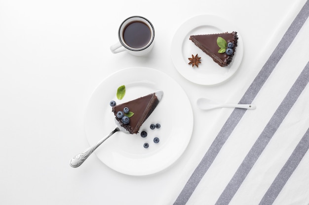 Top view of chocolate cake slices on plates