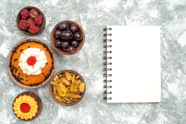 Top view chocolate chips cake with raisins and fruits on white background sweet pie cookie biscuit cake sugar