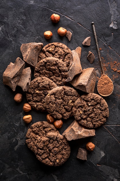 Free Photo top view of chocolate cookies with hazelnuts and cocoa powder