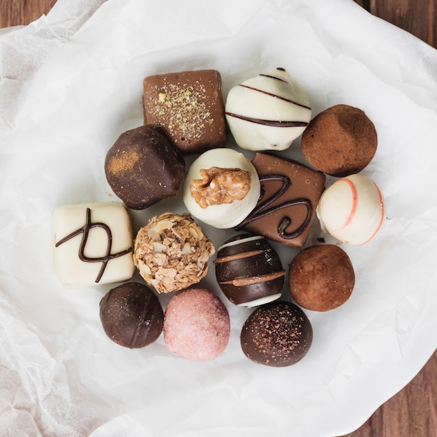 Free photo top view chocolate selection on a plate