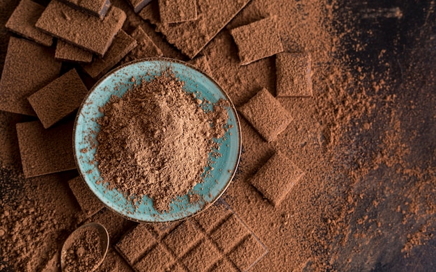 Free photo top view of chocolate with cocoa powder