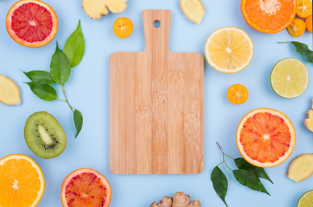 Free Photo top view chopping board with fresh fruits