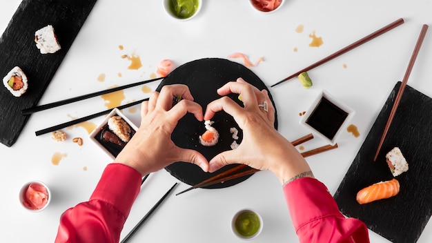 Free photo top view over chopsticks with sushi