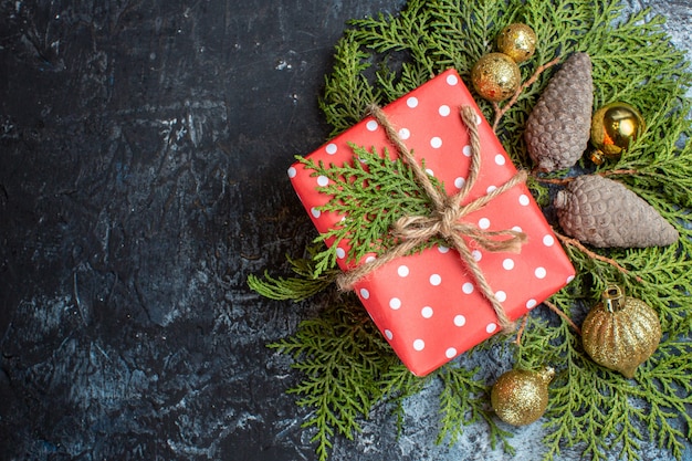 Top view christmas presents with green branch