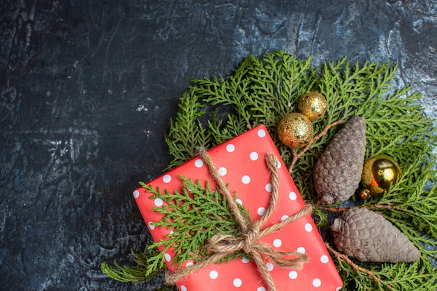 Top view christmas presents with green branch