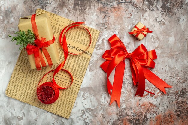 Top view christmas presents with red bows on white background