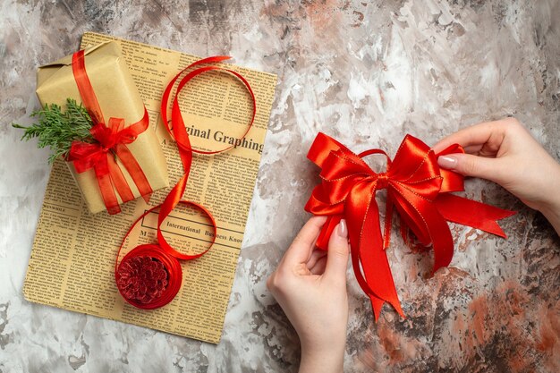 Top view christmas presents with red cones on white background