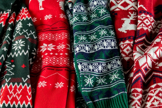 Free photo top view christmas sweaters arrangement