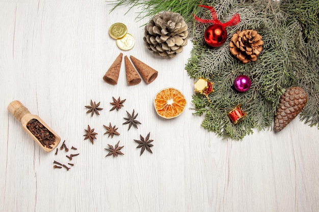 Top view christmas tree with cones and toys on white space