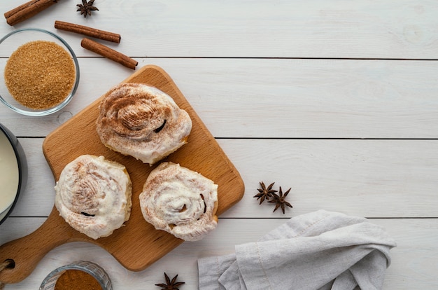 Top view cinnamon rolls on wooden board