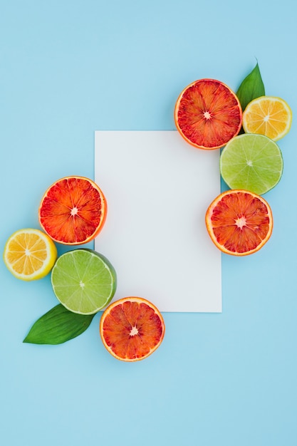 Top view citrus fruits with paper