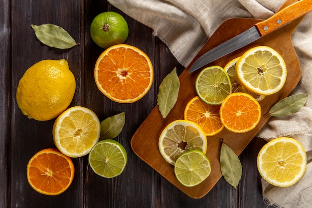 Free Photo top view of citrus slices with knife