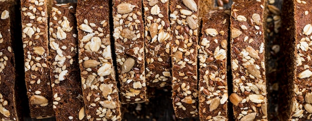 Free photo top view close-up slices of whole-grain bread