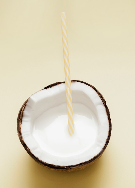 Top view coconut milk with plastic straw