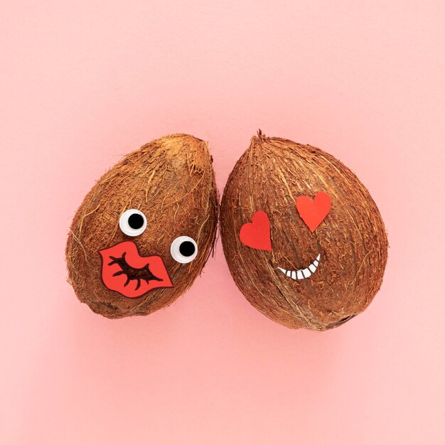 Top view coconuts on pink background