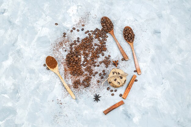 Top view coffee beans and spices on grunge background