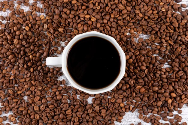 Top view coffee beans with coffee cup  surface