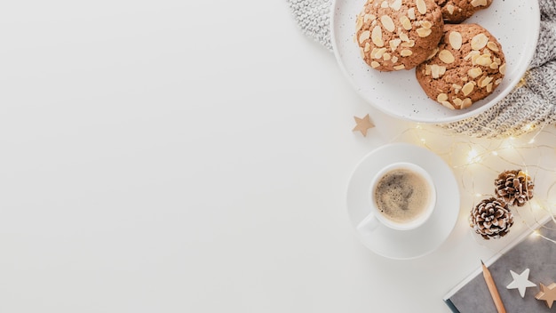 Top view coffee cup and cookies with copy-space