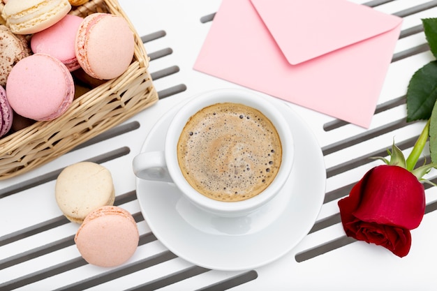 Free photo top view of coffee cup with rose for valentines day