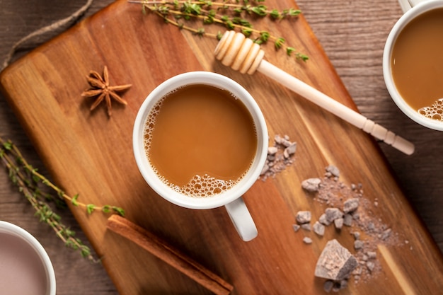 Top view coffee cups on wooden board