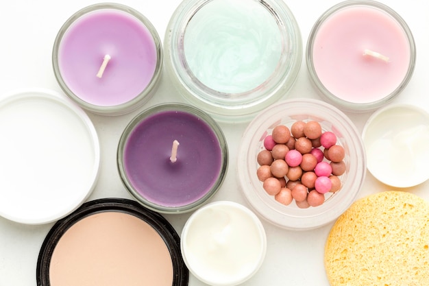 Free photo top view collection of cosmetic products and candles