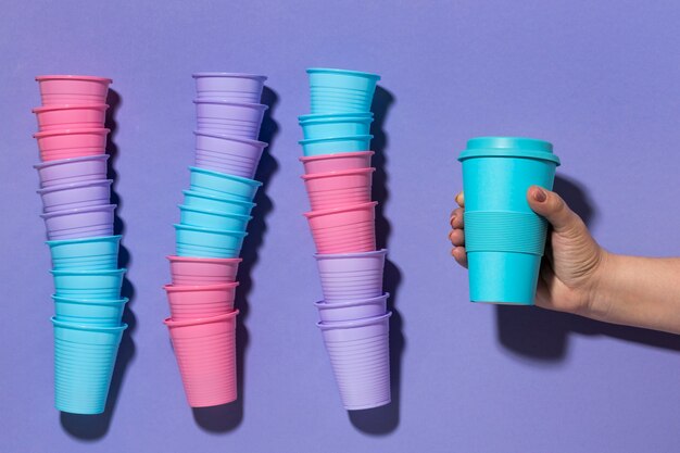 Top view collection of plastic cups on the table