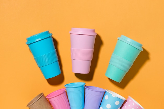 Free photo top view collection of plastic cups on the table