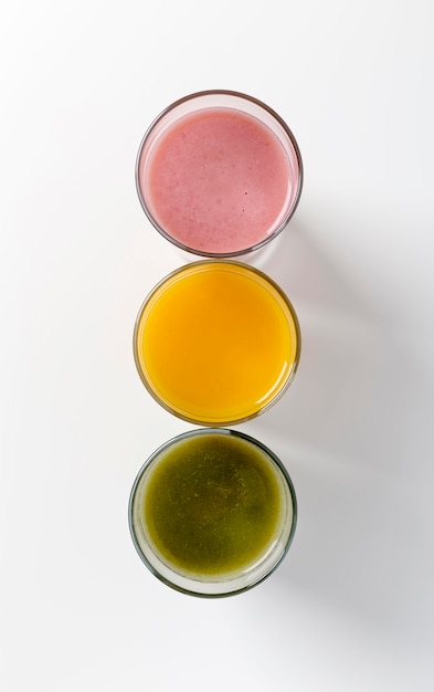 Top view colorful arrangement of fresh smoothies