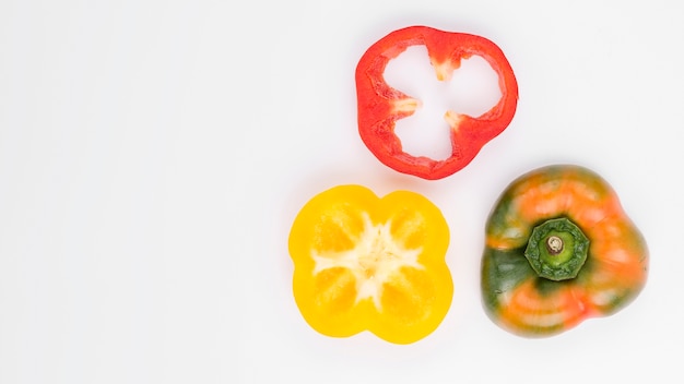 Top view colorful bell peppers with copy space