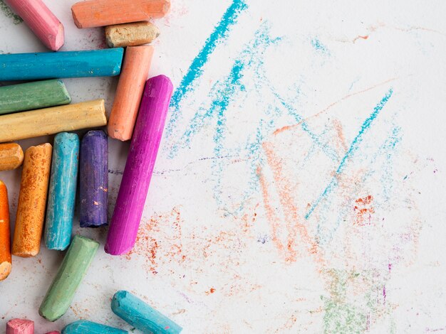 Top view of colorful chalk with copy space