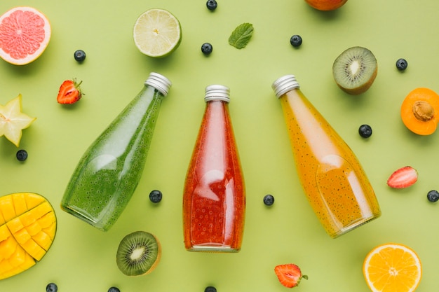 Top view colorful fruit and juices