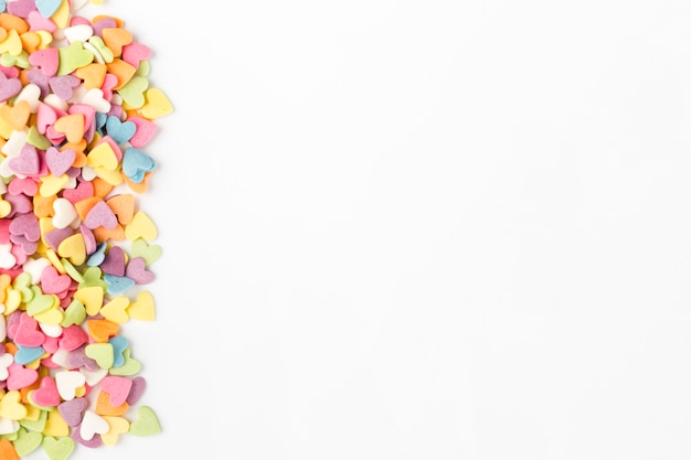 Top view of colorful heart-shaped candy