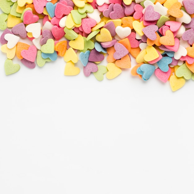 Free photo top view of colorful heart-shaped sweets