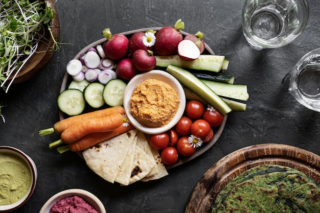 Top view over colorful hummus