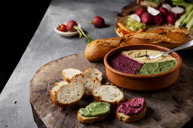 Free photo top view over colorful hummus