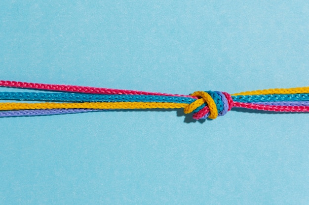 Free Photo top view colorful knot on blue background