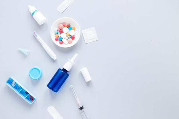 Top view colorful medicine with pillbox on the table