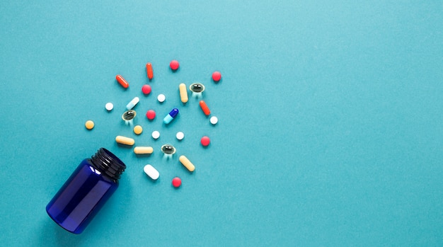 Top view colorful pills with copy space