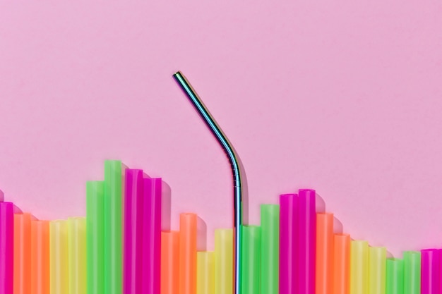 Free photo top view of colorful plastic straws mixed with metal