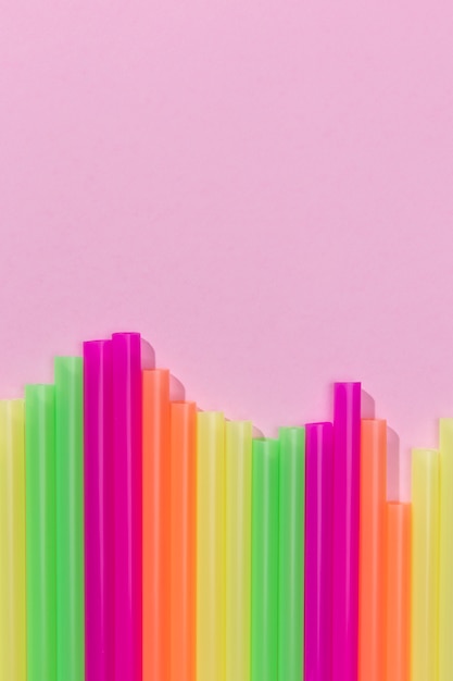 Free photo top view of colorful plastic straws