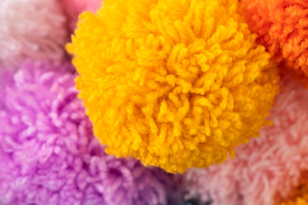 Free photo top view colorful pom poms arrangement