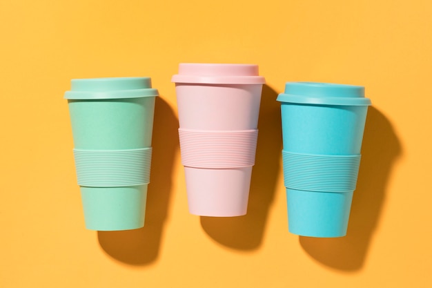 Free photo top view colorful reusable cups