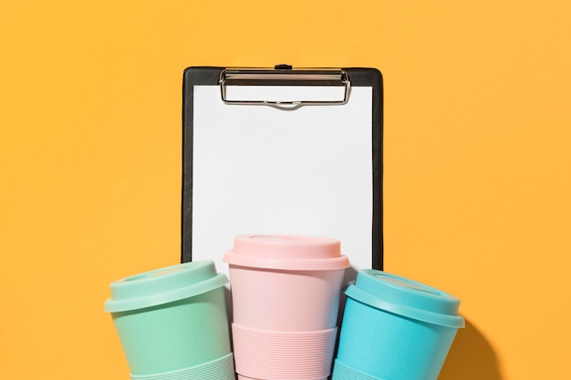 Free Photo top view colorful reusable cups