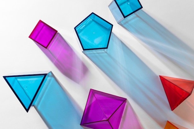 Free Photo top view of colorful translucent geometric shapes