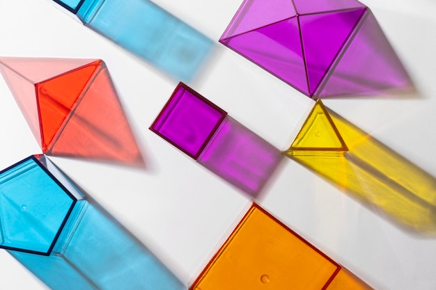 Free photo top view of colorful translucent geometric shapes