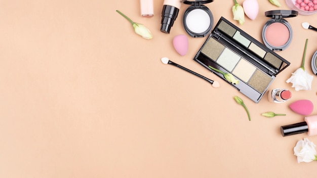 Top view composition of cosmetics with copy space