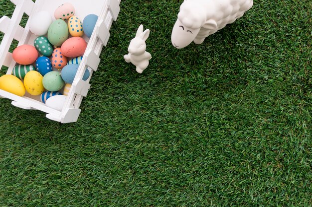 Top view of composition with fence and easter animals