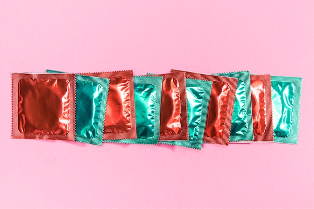 Free Photo top view condoms in red and green wrappers